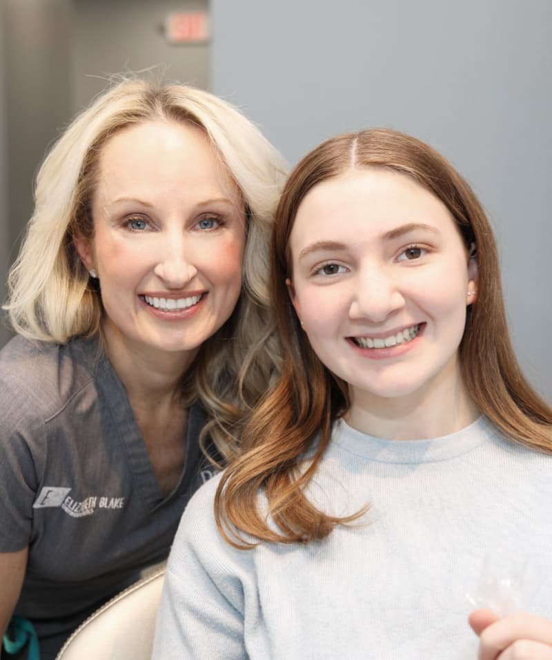 doctor and teen patient smiling after treatment